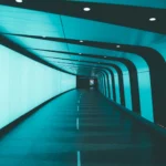 a very long tunnel with a light at the end